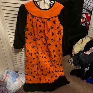 Orange and black with pumpkins and witches pajama dress with tie back.